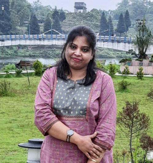 Shrabani Dasgupta, an experienced Vedic astrologer, pictured in an outdoor setting, representing trust, expertise and experience in astrology and horoscopy.